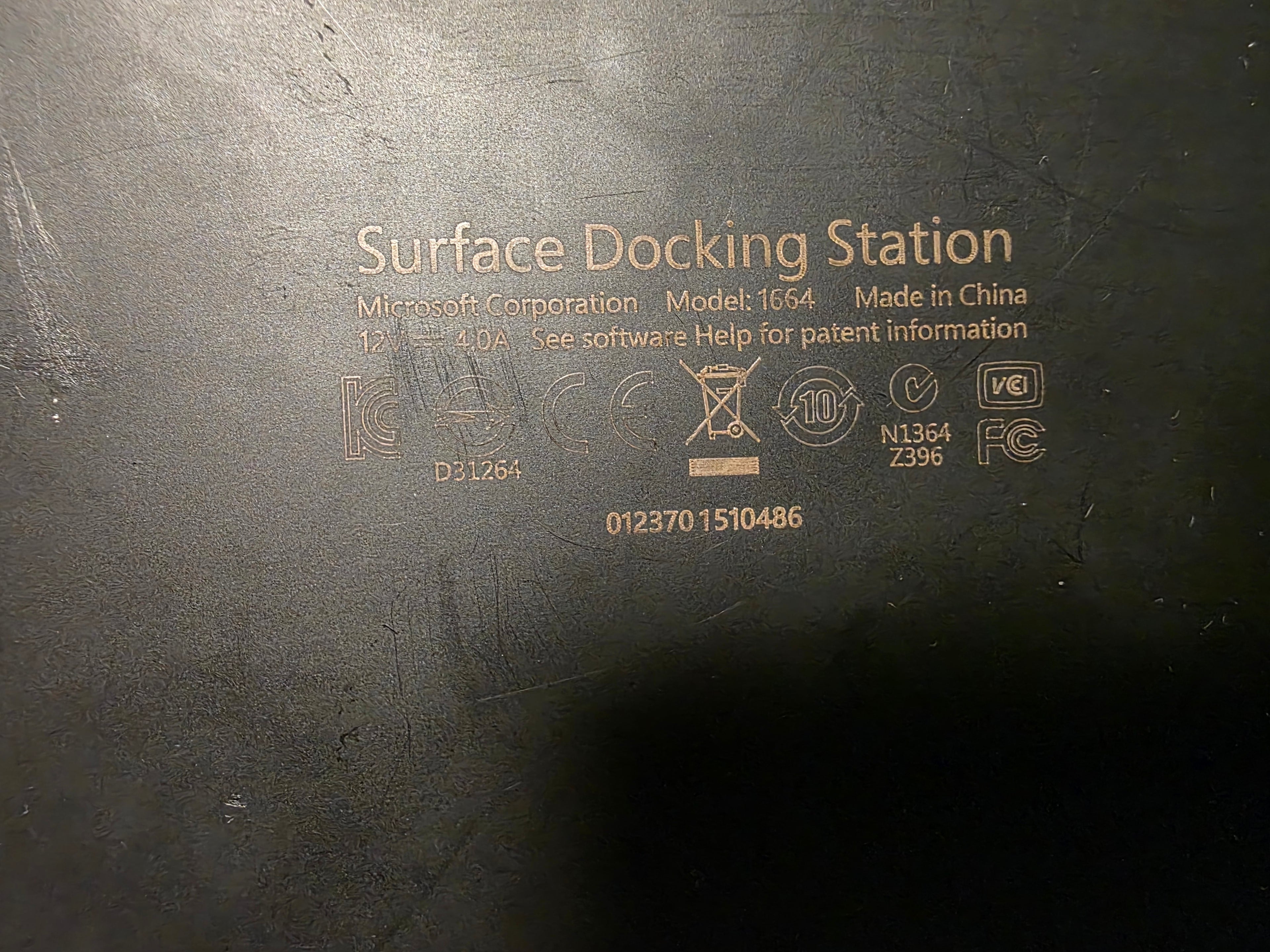 Label on a Microsoft Surface Docking Station with text and logos.