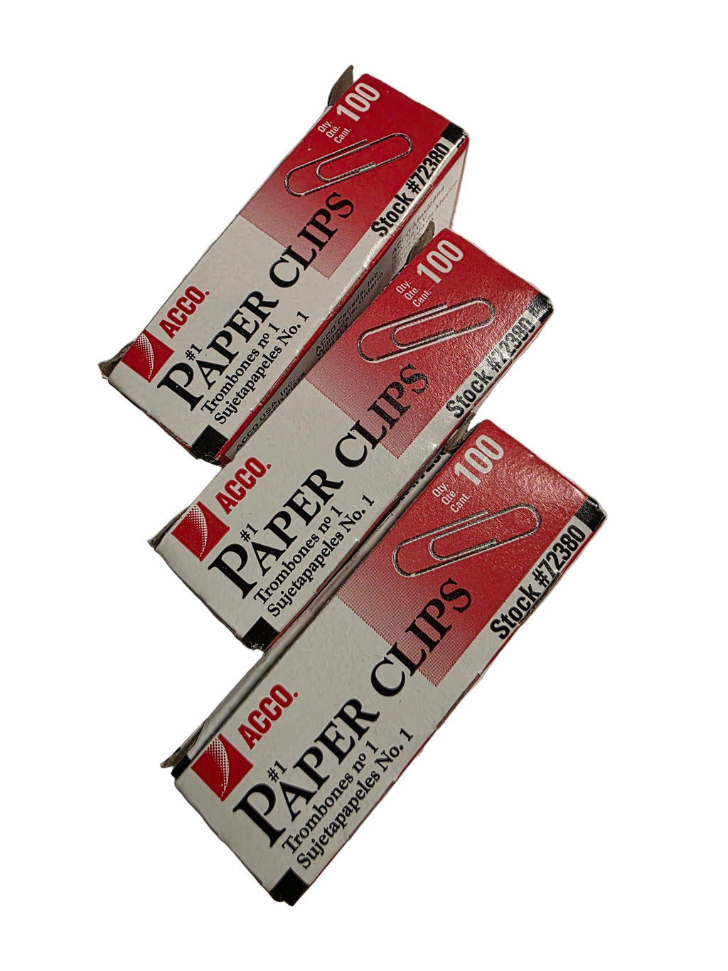 Three boxes of ACCO paper clips on a scratched metal surface